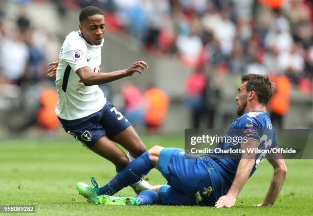 Kyle Walker-Peters of Tottenham is tackled by Christian Fuchs of Leicester during the Premier League match between Tottenham Hotspur and Leicester...