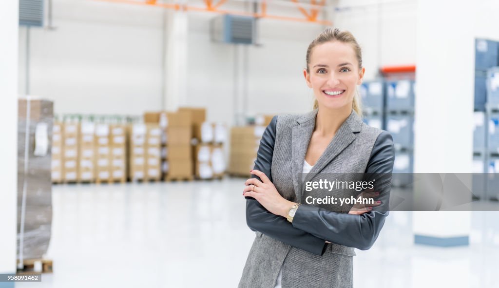 Businesswoman at warehouse