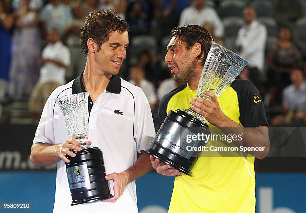 Marcos Baghdatis of Cyprus talks to Richard Gasquet after winning their men's final during day seven of the 2010 Medibank International at Sydney...