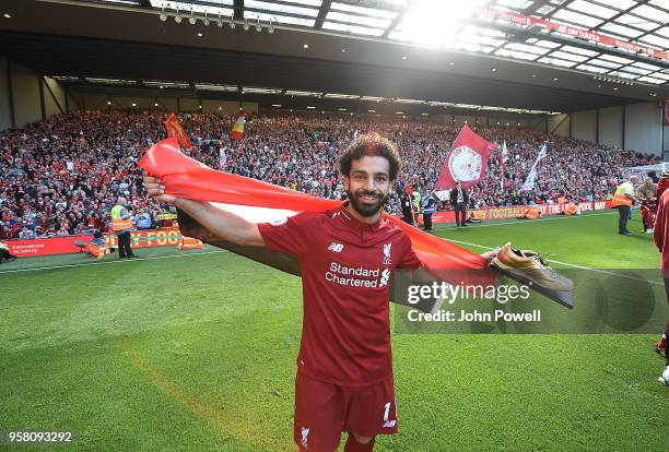 Mohamed Salah of Liverpool shows his appreciation to the fans at the end of the Premier League match between Liverpool and Brighton and Hove Albion...