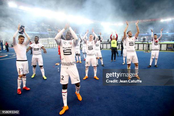 Joris Gnagnon, James Lea Siliki, Benjamin Bourigeaud, Rami Bensebaini of Rennes celebrate the victory in front of their supporters following the...