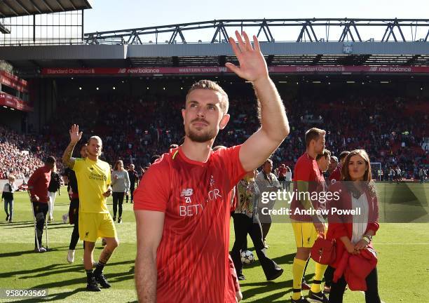 Jordan Henderson of Liverpool shows his appreciation to the fans at the end of the Premier League match between Liverpool and Brighton and Hove...