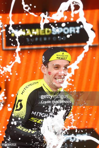 Pink jersey Britain's rider of team Mitchelton-Scott Simon Yates celebrates on the podium after winning the 9th stage between Pesco Sannita and the...