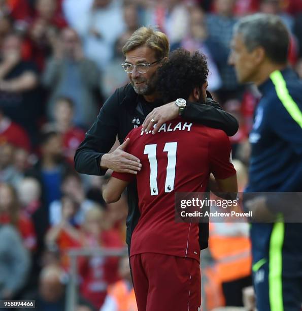 Jurgen Klopp manager of Liverpool embraces Mohamed Salah during the Premier League match between Liverpool and Brighton and Hove Albion at Anfield on...