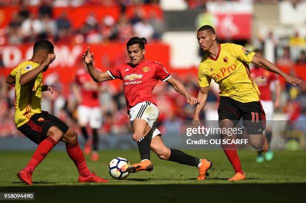 Manchester United's Chilean striker Alexis Sanchez takes on Watford's English-born Jamaican defender Adrian Mariappa and Watford's Brazilian striker...