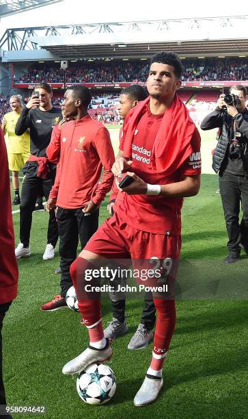 Dominic Solanke of Liverpool shows his appreciation to the fans at the end of the Premier League match between Liverpool and Brighton and Hove Albion...