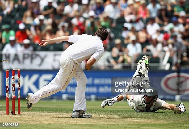 Ryan McLaren of South Africa makes his ground as Graeme Swann of England attempts to run him out during day three of the fourth test match between...