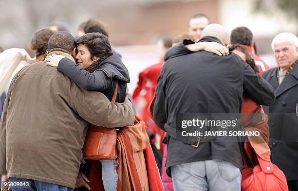 Spanish and Haitians survivors from the huge earthquake that devastated Haiti on January 12, are welcomed by relatives upon their arrival at the...