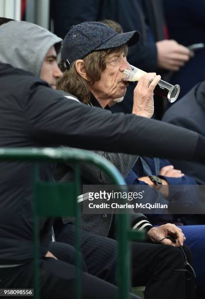 Mick Jagger enjoys a pint of Guinness during the third day of the test cricket match between Ireland and Pakistan on May 13, 2018 in Malahide,...