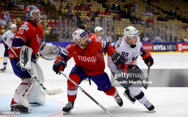 Daniel Sorvik of Norway and Cam Atkinson of United States battle for position during the 2018 IIHF Ice Hockey World Championship Group B game between...