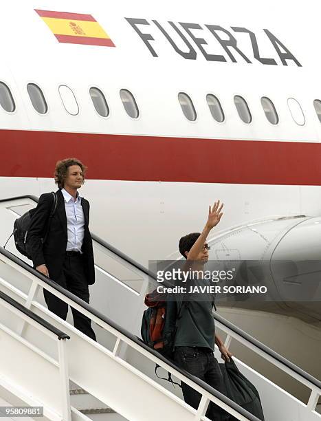 Survivors from the huge earthquake that devastated Haiti on January 12, arrive at the Torrejon de Ardoz airport in Madrid, on January 16, 2010. The...