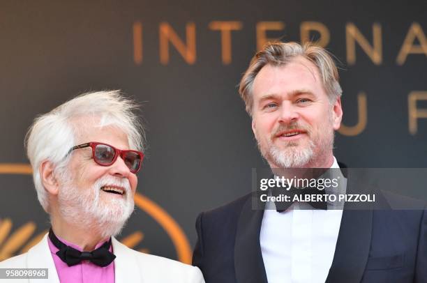 German-US producer Jan Harlan and British director Christopher Nolan pose as they arrive on May 13, 2018 for the screening of a remastered version of...