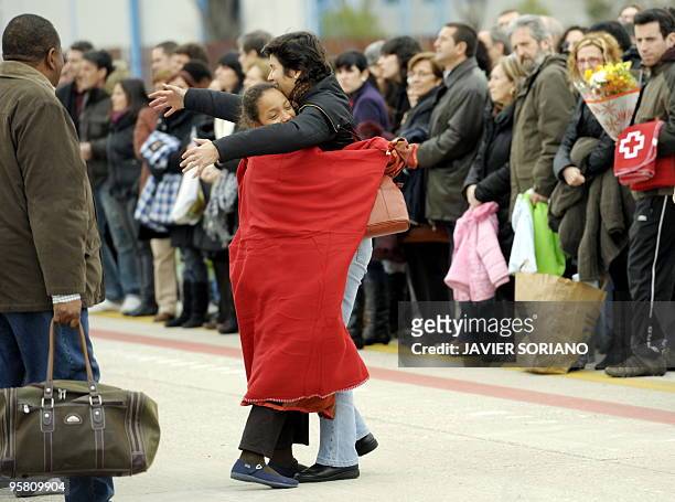Survivors from the huge earthquake that devastated Haiti on January 12, are welcomed by relatives upon their arrival at the Torrejon de Ardoz airport...