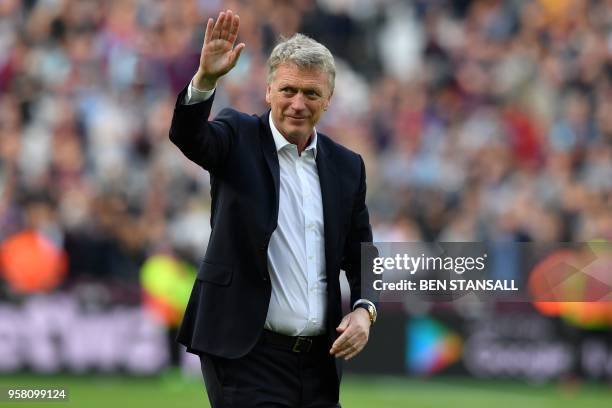 West Ham United's Scottish manager David Moyes waves to supporters on the pitch after the English Premier League football match between West Ham...