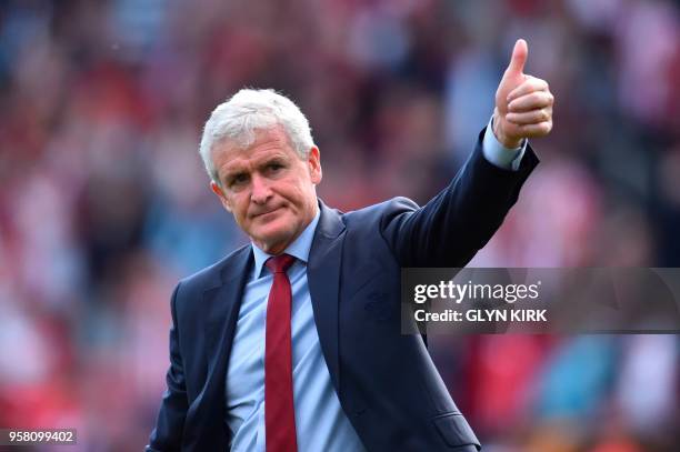 Southampton Welsh manager Mark Hughes gives a thumbs up to the fans at the end of the English Premier League football match between Southampton and...