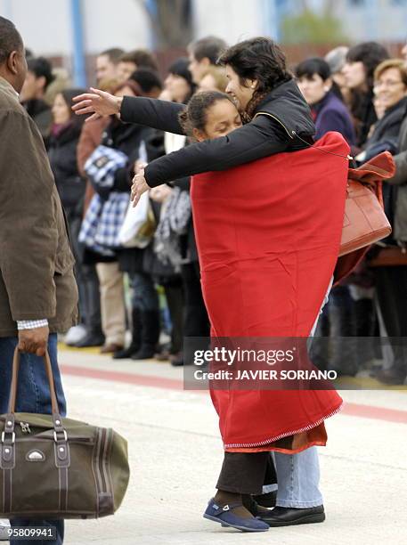 Survivors from the huge earthquake that devastated Haiti on January 12, are welcomed by relatives upon their arrival at the Torrejon de Ardoz airport...