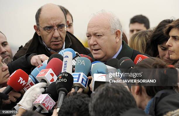 Spanish Foreign Minister Miguel Angel Moratinos talks to the press after a plane with survivors from the huge earthquake that devastated Haiti on...