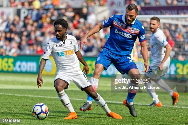 Nathan Dyer of Swansea City closely marked by Erik Pieters of Stoke City during the Premier League match between Swansea City and Stoke City at The...