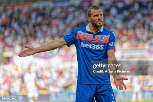 Erik Pieters of Stoke City protests to the assistant referee during the Premier League match between Swansea City and Stoke City at The Liberty...