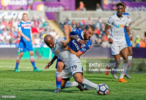 Andre Ayew of Swansea City brought down by Erik Pieters of Stoke City during the Premier League match between Swansea City and Stoke City at The...