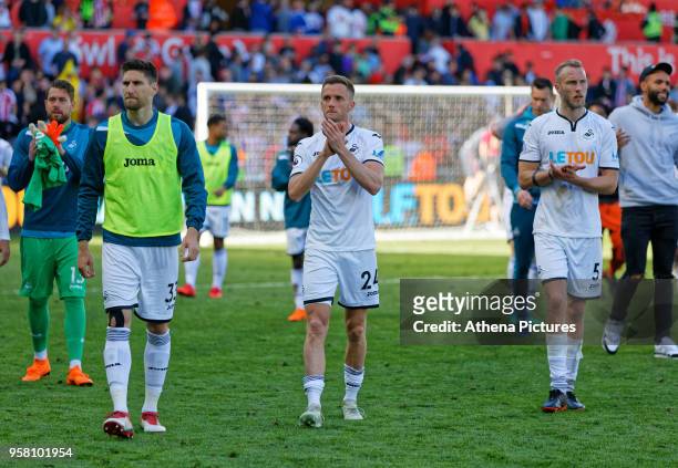 Federico Fernandez, Andy King and Mike van der Hoorn of Swansea City thanks supporters after the end of the game during the Premier League match...
