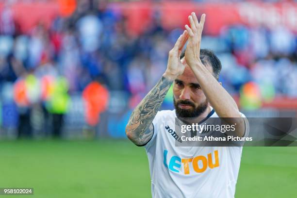 Leon Britton of Swansea City thanks home supporters after the end of the game during the Premier League match between Swansea City and Stoke City at...