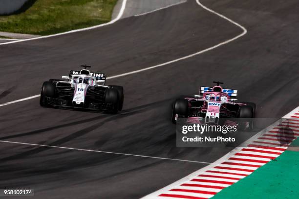 Lance Stroll from Canada with Williams F1 Mercedes FW41 overtaking 11 Sergio Perez from Mexico with Force India F1 VJM11 during the Spanish Formula...