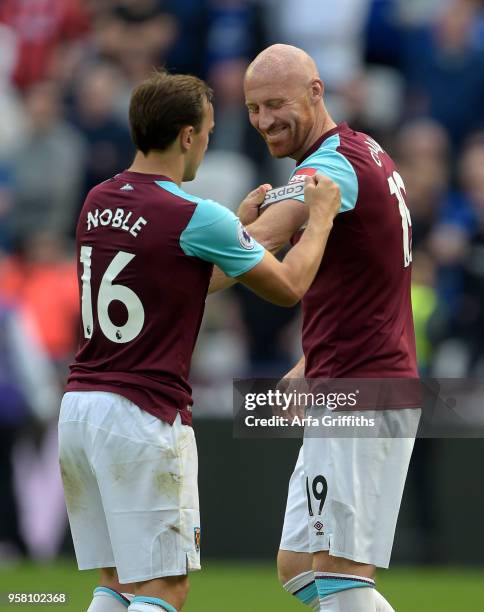 James Colins and Mark Noble of West Ham United during the Premier League match between West Ham United and Everton at London Stadium on May 13, 2018...