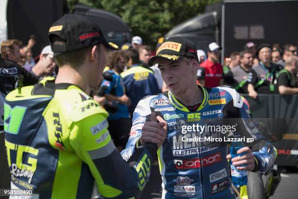 Kevin Sbatucci of Italy and ProGP Racing and Borja Sanchez of Spain and ETG Racing celebrate under the podium at the end of the SuperSport300 during...