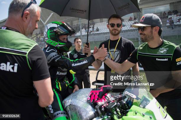 Ana Carrasco of Spain and DS Junior Team greets Kenan Sofuoglu of Turkey and Kawasaki Puccetti Racing and prepares to start on the grid during the...