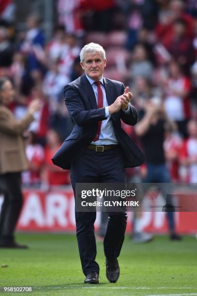 Southampton Welsh manager Mark Hughes applauds at the fans at the end of the English Premier League football match between Southampton and Manchester...