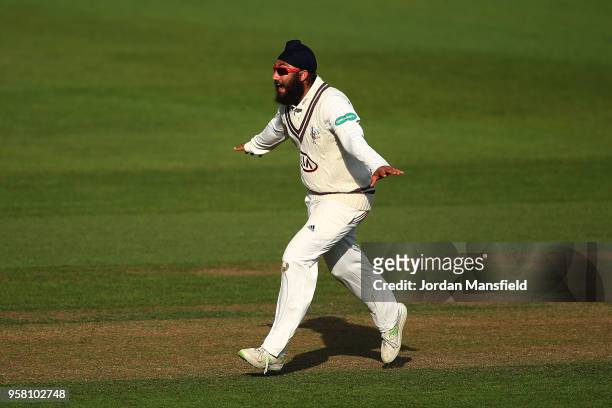 Amar Virdi of Surrey celebrates dismissing Harry Brook of Yorkshire during day three of the Specsavers County Championship Division One match between...