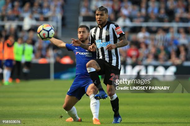 Chelsea's Belgian midfielder Eden Hazard vies with Newcastle United's US defender DeAndre Yedlin during the English Premier League football match...
