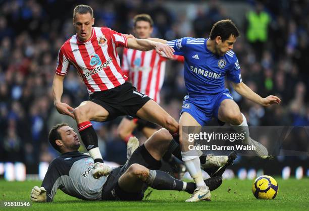 Joe Cole of Chelsea tangles with David Meyler of Sunderland and Martin Fulop the Sunderland goalkeeper during the Barclays Premier League match...