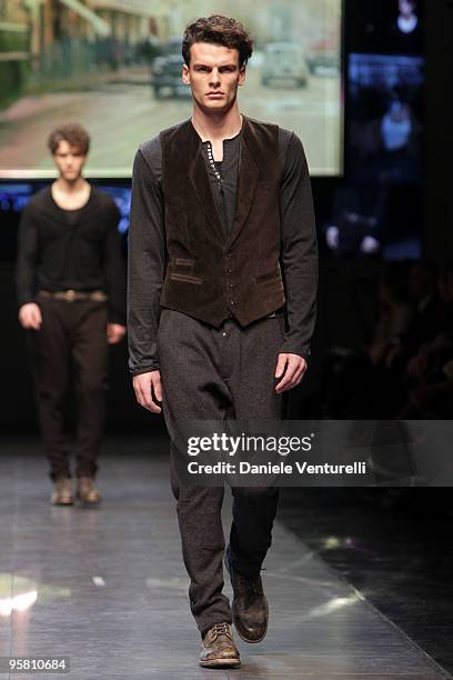 Model walks the runway during the Dolce & Gabbana Milan Menswear Autumn/Winter 2010 show on January 16, 2010 in Milan, Italy.