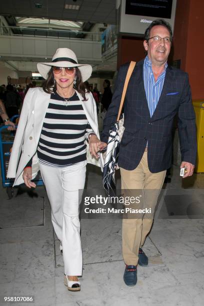 Actress Joan Collins and husband Percy Gibson are seen during the 71st annual Cannes Film Festival at Nice Airport on May 13, 2018 in Nice, France.