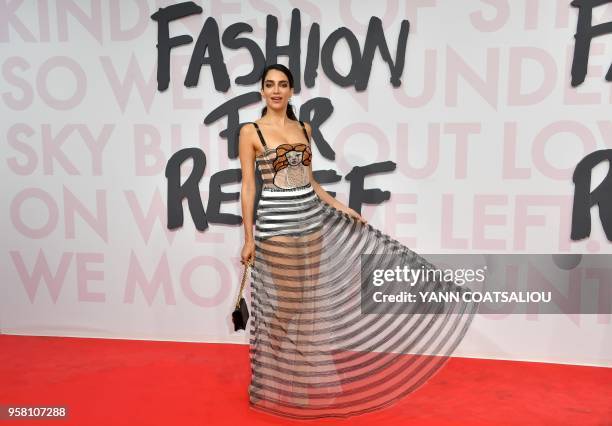 Lebanese - Australian model and lawyer, Jessica Kahawaty attends on May 13, 2018 the Fashion For Relief Cannes 2018 event on the sidelines of the...