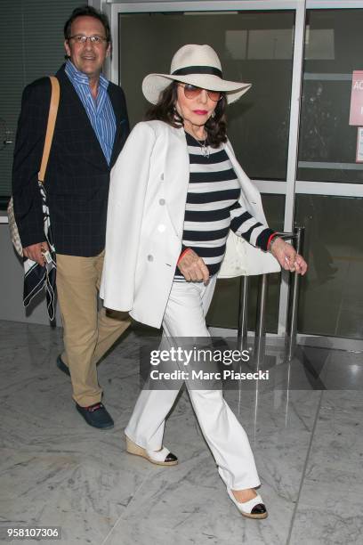 Actress Joan Collins and husband Percy Gibson are seen during the 71st annual Cannes Film Festival at Nice Airport on May 13, 2018 in Nice, France.