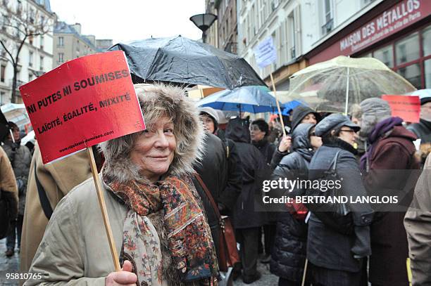 People gather during a protest organized by the Women's rights associations "Ni putes ni soumises" on January 16, 2010 in front of the 'Maison des...