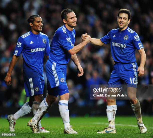 Frank Lampard of Chelsea celebrates scoring his sides fourth goal with team mates Joe Cole and Florent Malouda during the Barclays Premier League...