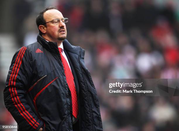 Rafael Benitez the manager of Liverpool watches from the touchline during the Barclays Premier League match between Stoke City and Liverpool at the...