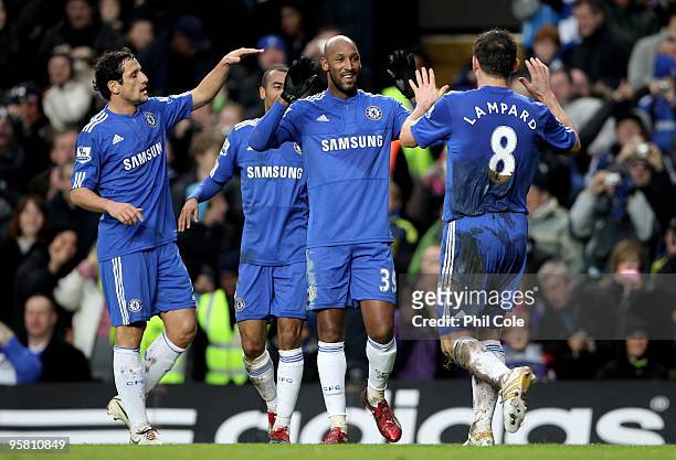 Frank Lampard of Chelsea is congraulated by teammate Nicolas Anelka after scoring his team's third goal during the Barclays Premier League match...