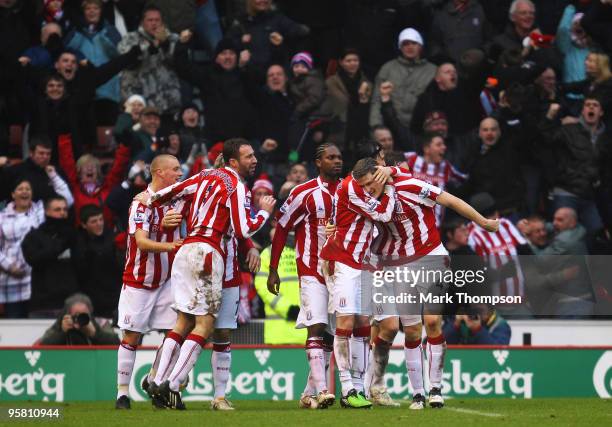 Robert Huth of Stoke City celebrates his goal with team mates during the Barclays Premier League match between Stoke City and Liverpool at the...