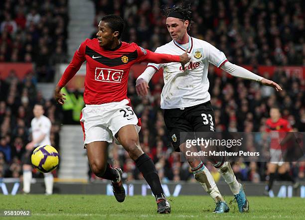 Antonio Valencia of Manchester United clashes with Chris Eagles of Burnley during the FA Barclays Premier League match between Manchester United and...