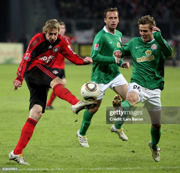 Stefan Kiessling of Leverkusen is challenged by Niko Bungert of Mainz during the Bundesliga match between Bayer Leverkusen and FSV Mainz 05 at...