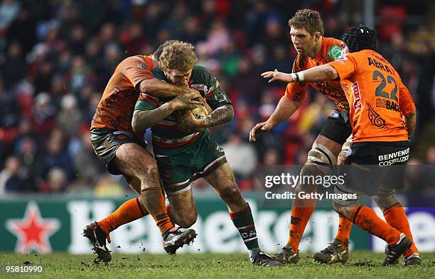 Sam Vesty of Leicester is caught by the Viadana defence during the Heineken Cup match between Leicester Tigers and Viadana at Welford Road on January...