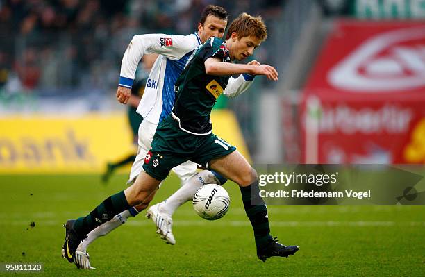 Marco Reus of Moenchengladbach in action with Christoph Dabrowski of Bochum during during the Bundesliga match between Borussia Moenchengladbach and...