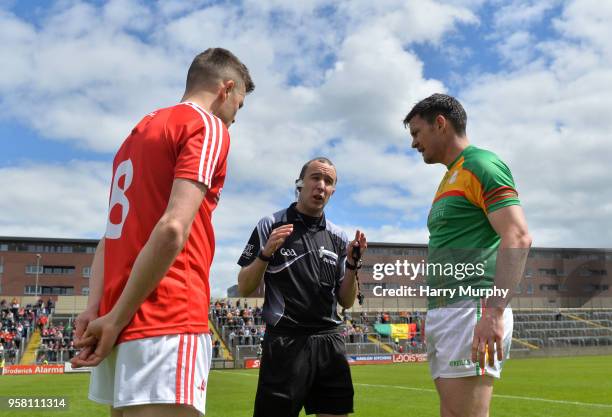 Laois , Ireland - 13 May 2018; Referee Niall Cullen speaks with Louth captain Andy McDonnell and Carlow captain John Murphy prior to the Leinster GAA...