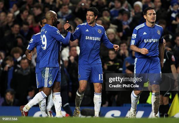 Michael Ballack of Chelsea is congraulated by teammate Nicolas Anelka after scoring his team's fifth goal during the Barclays Premier League match...