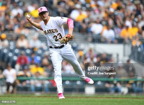 David Freese of the Pittsburgh Pirates throws over to first base during the second inning against the San Francisco Giants at PNC Park on May 13,...